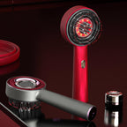 Red and gray Cordless Electric Scalp and Hair Massager on a dark background