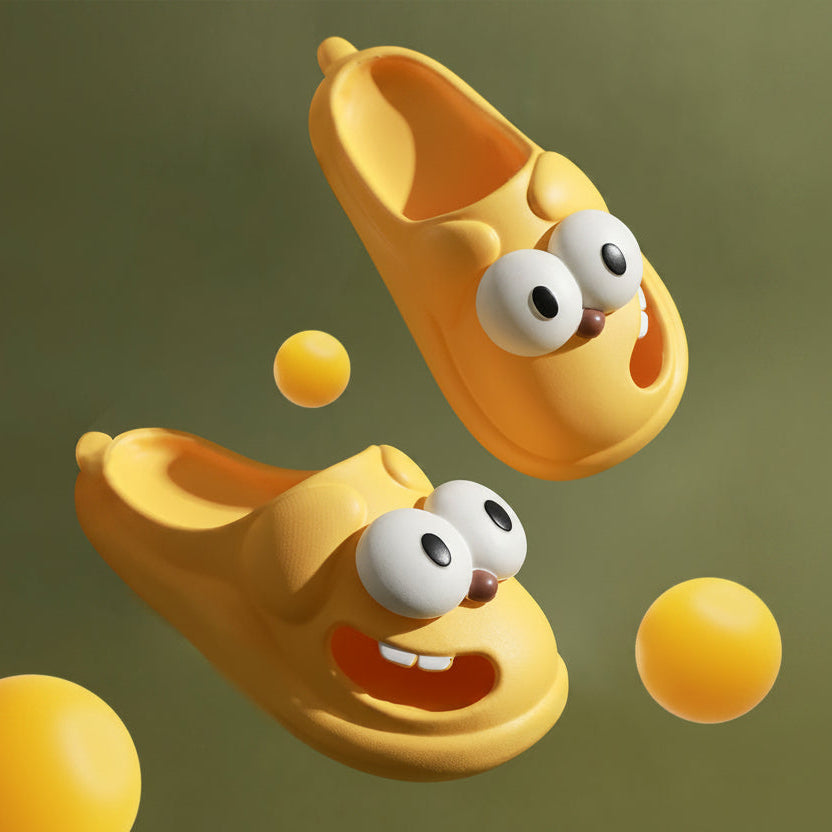 Yellow cartoon slippers with googly eyes on a green background