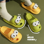 Two pairs of cartoonish shoes with face designs on a green background, featuring the text 'HELLO FRIENDS'.