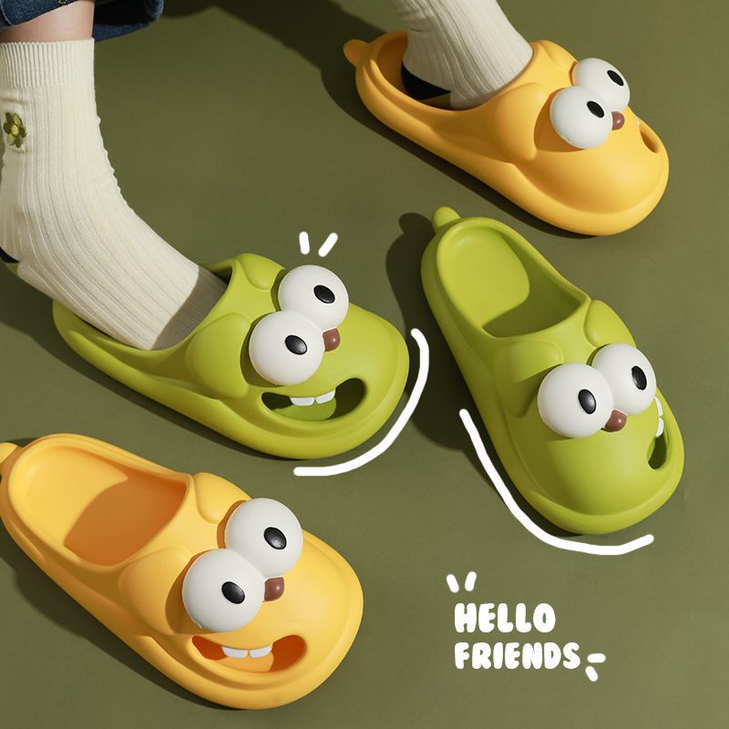 Two pairs of cartoonish shoes with face designs on a green background, featuring the text 'HELLO FRIENDS'.